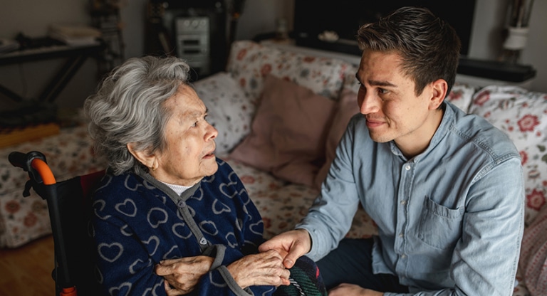 Elderly woman with young man