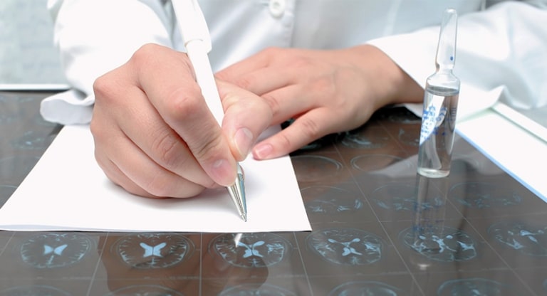 Doctor writes notes on Alzheimer's drug