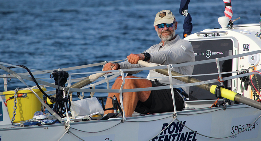 Ian Rivers rowing a boat