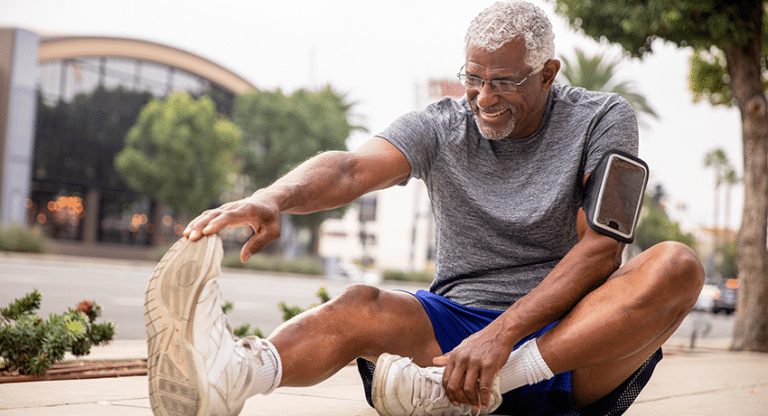 Male stretching before exercising